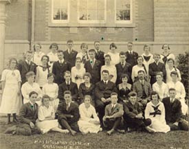 Group portrait of the matriculation class of 1919.  Group includes young men wearing Soldiers of the Soil lapel pins identified by small green dots. P. Coll 42, file 12.