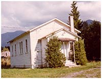 Colour photo showing the Columbia Valley school as it appeared in 1977. P7948.