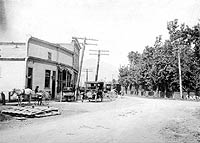 Vedder Road looking north at Knight Road, showing the Sardis Post Office, Langstaff Store, and Chilliwack Meat and Supply, ca. 1914-1919. P6915
