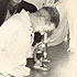 Harold W. German, Horace C. Clark, Guy A. Philip, George W. Challenger, with J.E.H. "Jack" Laurence looking into microscope at Chilliwack Artificial Insemination Centre, ca. 1960-1962. P7513.
