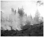 Smoke rising from burning slash, to make the reservoir on Little Mountain. P696
