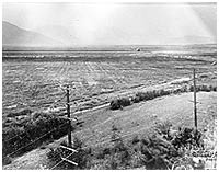 Sumas prairie following drainage of lake, with British Columbia Electric Railway line in foreground, late 1920s. P1474