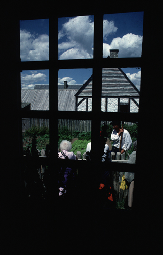 Reconstructed buildings - View of the De Gannes House Garden through a window in the house
Photographer: Jamie Steeves
Date of Photograph: Summer 1987
05-J-03-195