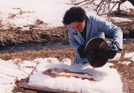 pouring syrup onto the snow