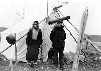 picture of Martha and Moses Tizya wearing Caribou hide moccasins
