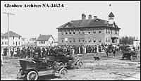 Crowd listening to speaker beside high school, Camrose, Alberta. ca. 1912-1913.