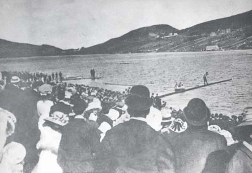 The crowd watching a man venturing across the greasy pole on Quidi Vidi Lake