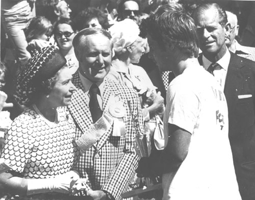 Queen Elizabeth II and Prince Phillip congratulate an unknown rower at the 1978 St. John's Regatta