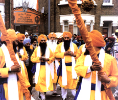 Five Sikhs performing a ceremony