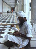 Sikh reading a prayer at a temple