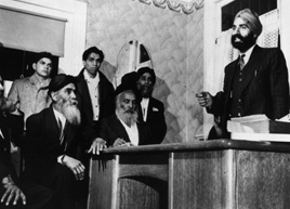 Naginder Singh Gill, secretary of the Khalsa Diwan Society, conducts a meeting in the
office with the Vancouver Sikh  Temple on the West 2nd Ave., 1946.
