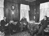 Four men seated in parlour