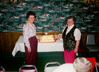 Ladies 40th anniversary cake being cut