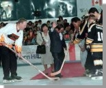 Prime Minister Chrtien plays hockey in Japan with Toshiyasu Shiroma, Mayor of Haebaru City, during the G8 Summit