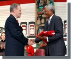Prime Minister Jean Chrtien presents to Nelson Mandela a Canadian flag that flew on the Peace Tower on Parliament Hill.