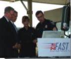 Prime Minister Chrtien and President Bush with Canadian and American customs officials getting an introduction to the FAST system (Detroit, September 9, 2002)