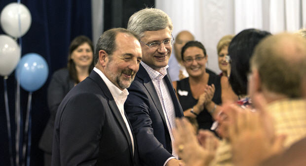 Prime Minister Stephen Harper and Denis Lebel, Minister of Transport, Infrastructure and Communities, Minister of the Economic Development Agency of Canada for the Regions of Quebec and Minister of Intergovernmental Affairs, attend a Saint-Jean-Baptiste Day celebration.