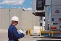 image - Person wearing safety equipment, holding a checklist