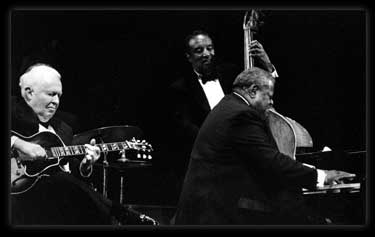 Photo: Peterson jamming with Ray Brown and Herb Ellis