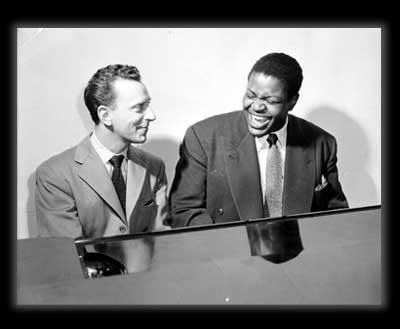 Photo: Oscar Peterson at the piano with Bert Pearl