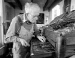 Photograph of Bill Poole composing type