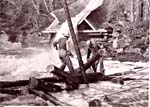 Photograph of Directing logs away from the timber chute, ca. [192-?] Centre régional d'archives de l'Outaouais/P030-01b,P35, image 1